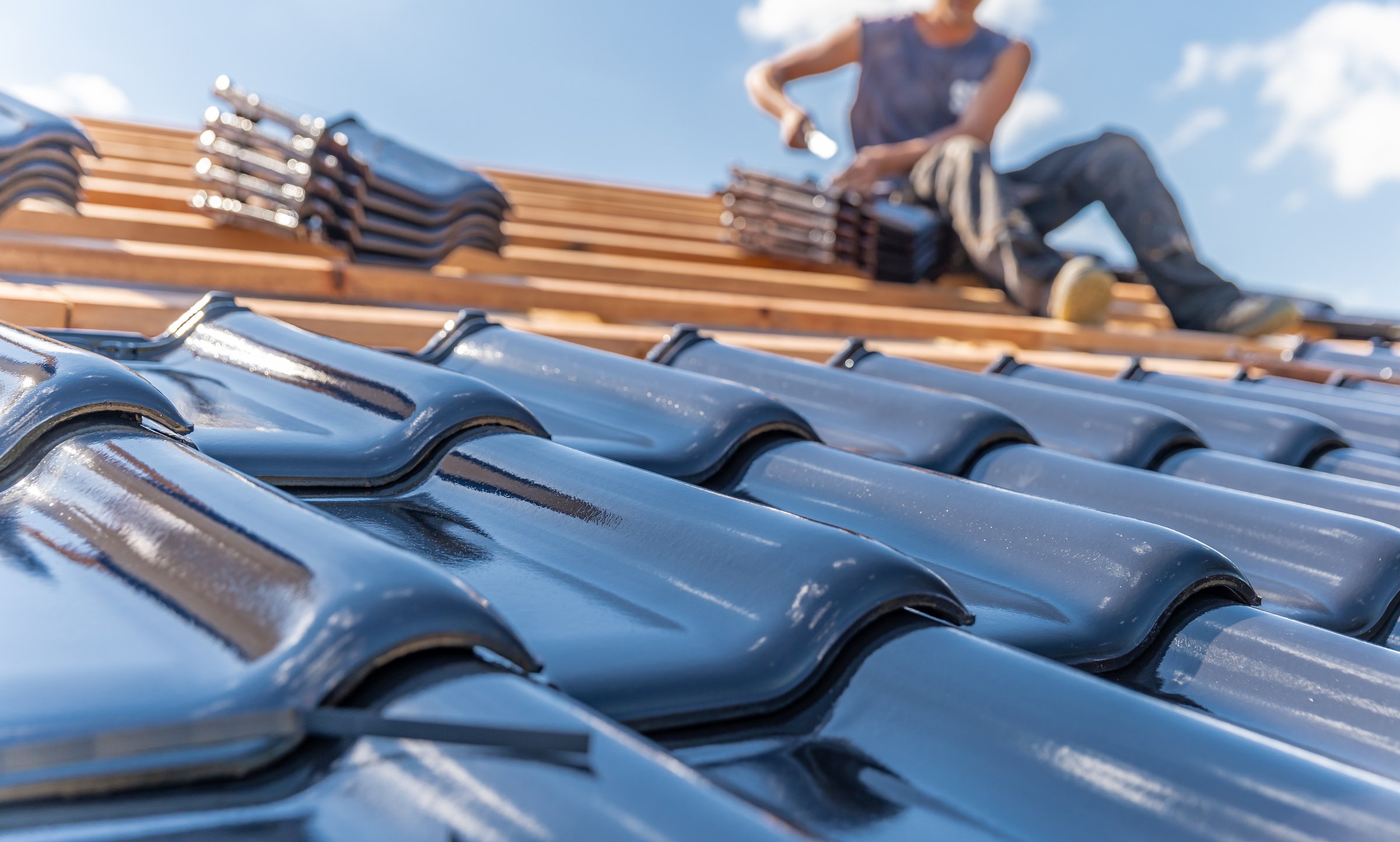 Man Installing Roof Tiles 